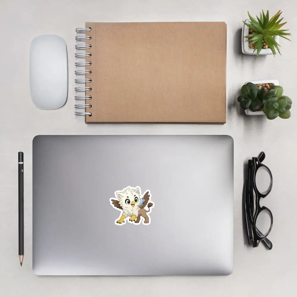 A product mockup of a 3x3" vinyl sticker on a silver laptop lid, featuring Echo the Griffin.