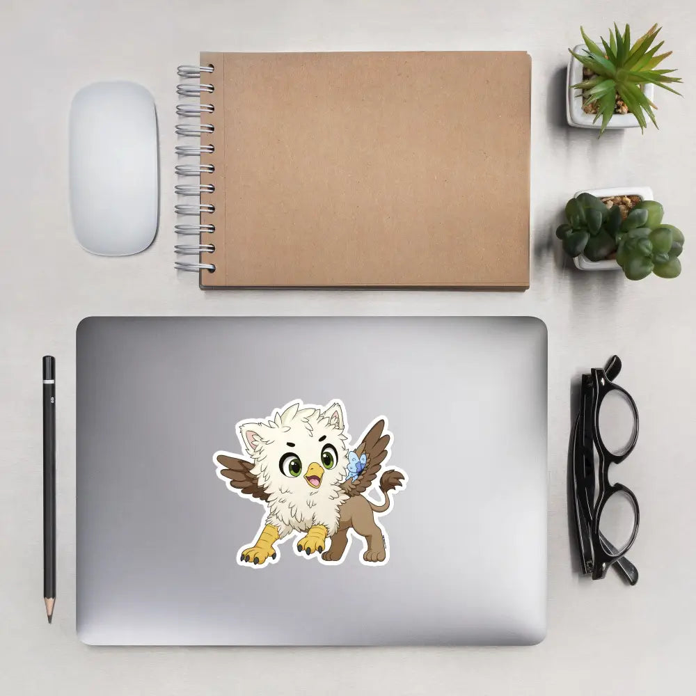 A product mockup of a 5x5" vinyl sticker on a silver laptop lid, featuring Echo the Griffin.