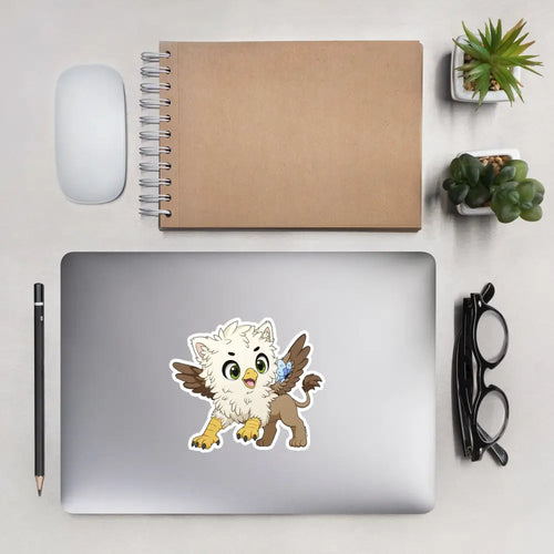 A product mockup of a 5x5" vinyl sticker on a silver laptop lid, featuring Echo the Griffin.