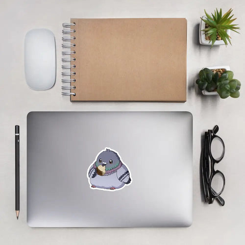 A product mockup of a 4x4" vinyl sticker on a silver laptop lid, featuring Fred the Pigeon.