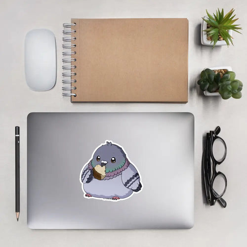A product mockup of a 5x5" vinyl sticker on a silver laptop lid, featuring Fred the Pigeon.