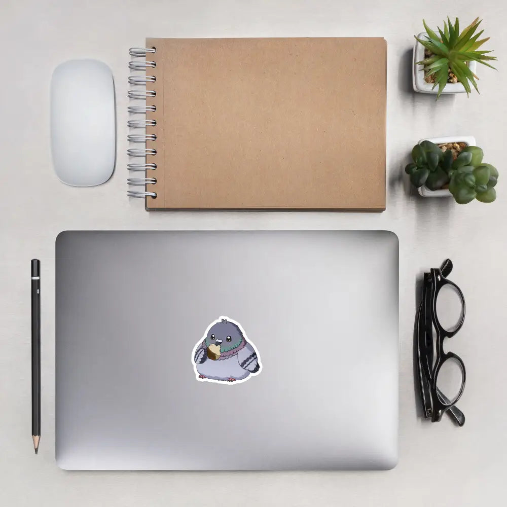 A product mockup of a 3x3" vinyl sticker on a silver laptop lid, featuring Fred the Pigeon.