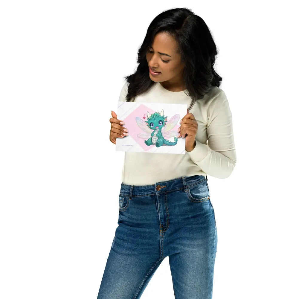 A product mockup of a 5x7" print being held by a pretty woman. The print features Tetra the Fairy Dragon.